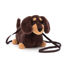 Load image into Gallery viewer, Plush Jellycat Sausage Dog shoulder bag with a leash on a white background
