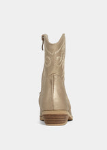 Load image into Gallery viewer, Gold metallic boot with decorative patterns on a white background
